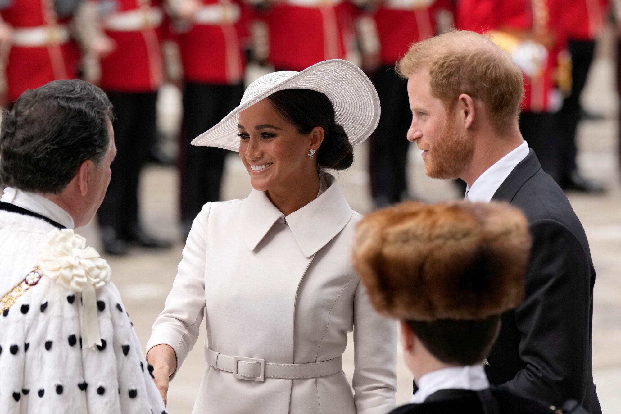 Britain's Prince Harry and Meghan, Duchess of Sussex, are greeted as they arrive for the National Service of Thanksgiving held at St Paul's Cathedral during the Queen's Platinum Jubilee celebrations in London, Britain, June 3, 2022. Matt Dunham/Pool via REUTERS