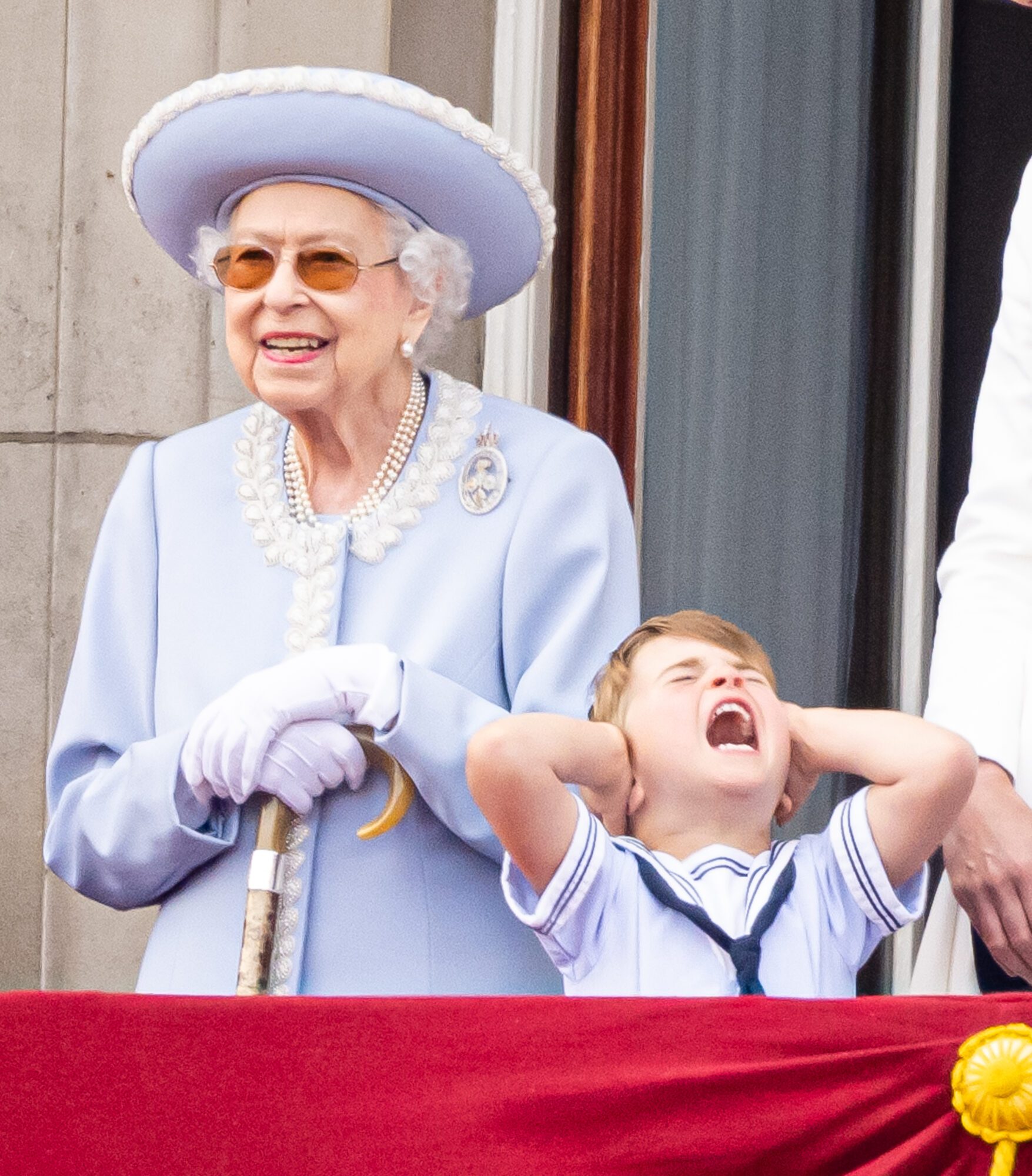 LONDON, ENGLAND - JUNE 02: Queen Elizabeth II and Prince Louis of Cambridge during Trooping the Colour on June 02, 2022 in London, England. Queen Elizabeth II, Prince Louis, Catherine, Duchess of Cambridge an Princess Charlotte during Trooping the Colour on June 02, 2022 in London, England.  on June 02, 2022 in London, England.Trooping The Colour, also known as The Queen's Birthday Parade, is a military ceremony performed by regiments of the British Army that has taken place since the mid-17th century. It marks the official birthday of the British Sovereign. This year, from June 2 to June 5, 2022, there is the added celebration of the Platinum Jubilee of Elizabeth II  in the UK and Commonwealth to mark the 70th anniversary of her accession to the throne on 6 February 1952. (Photo by Samir Hussein/WireImage)