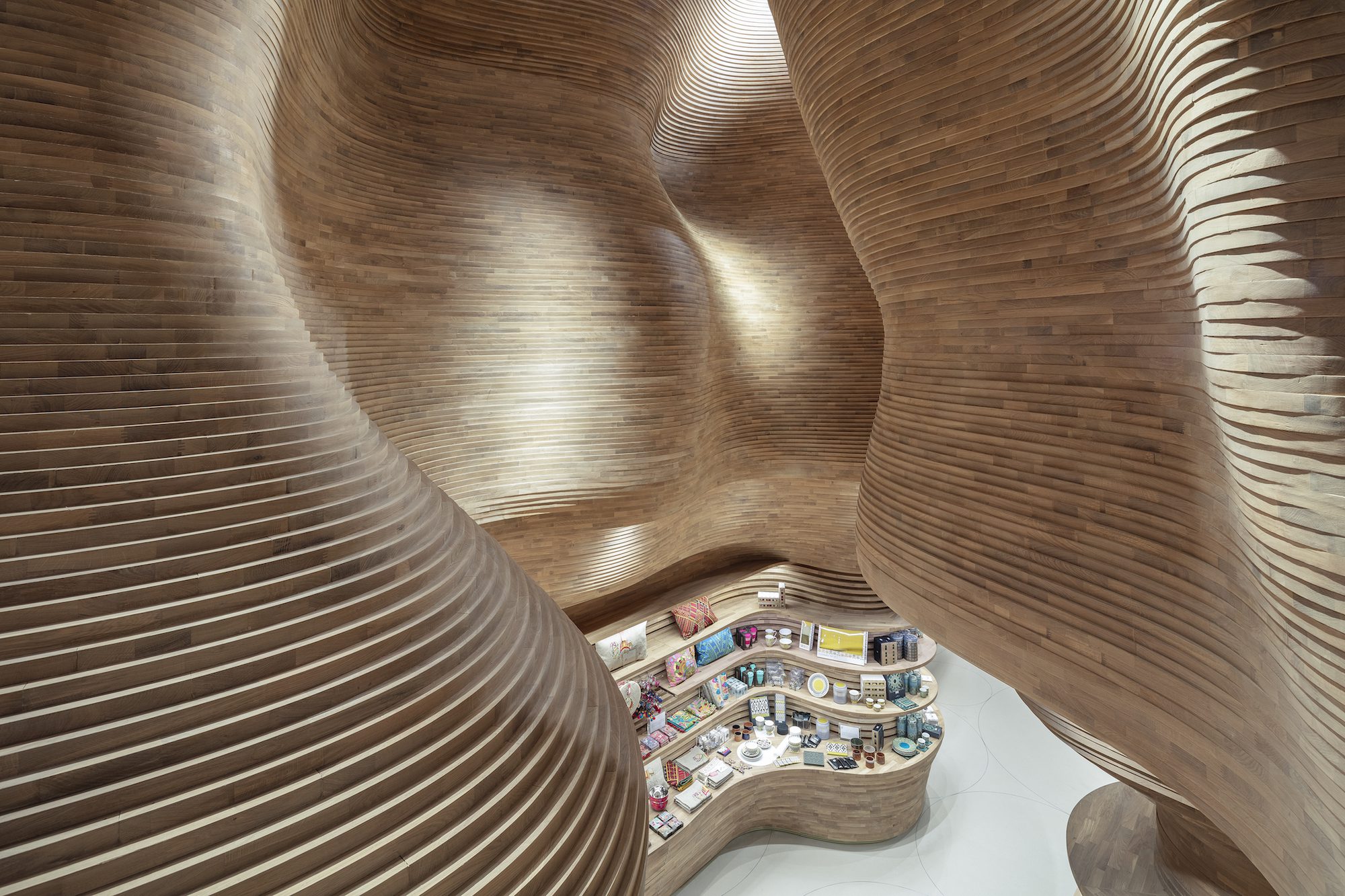The sculptural walls in the National Museum of Qatar Gift Shops in Doha evoke a cave-like atmosphere. Credit: Tom Ferguson