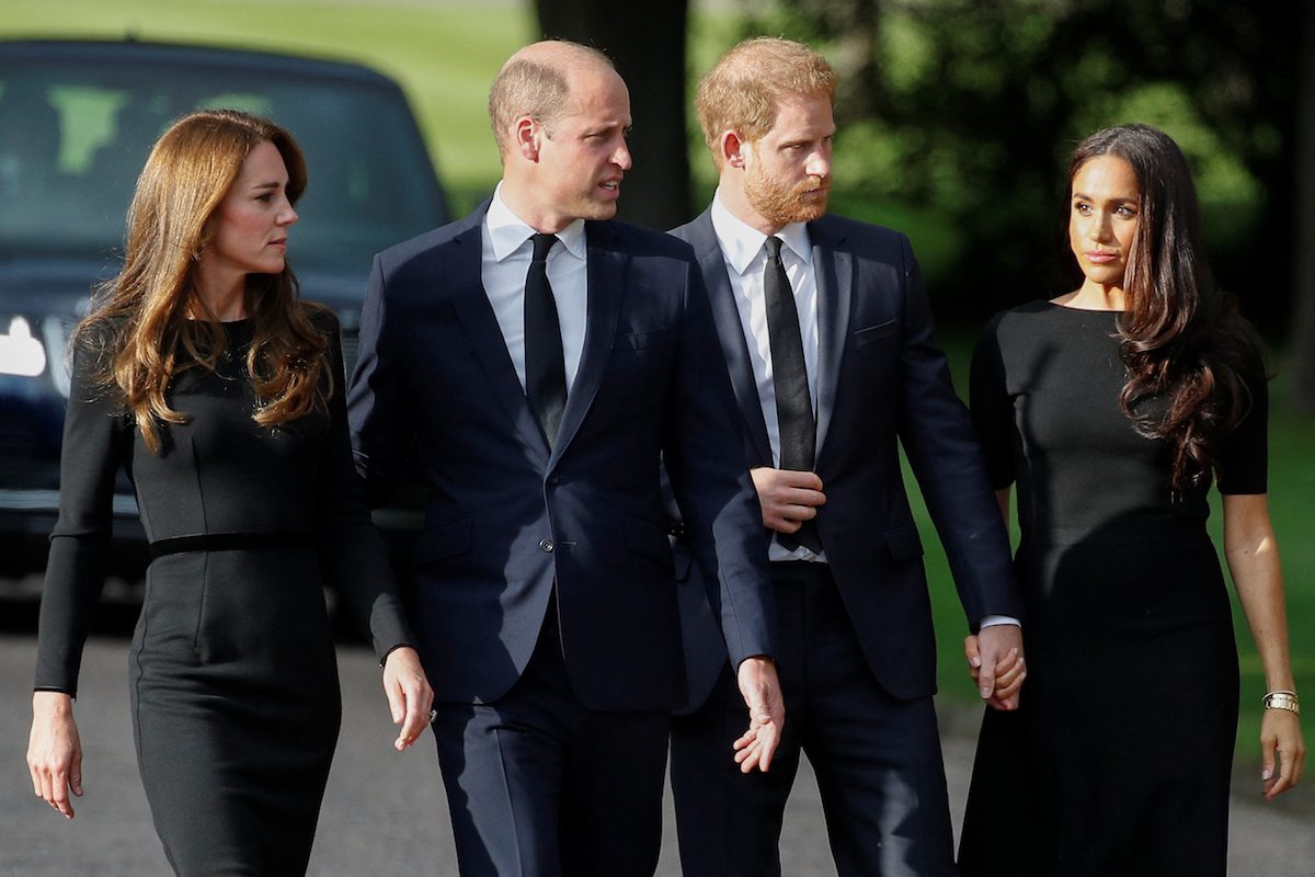 Britain's William, Prince of Wales, Catherine, Princess of Wales, Prince Harry and Meghan, the Duchess of Sussex walk outside Windsor Castle, following the passing of Britain's Queen Elizabeth, in Windsor, Britain, September 10, 2022. REUTERS/Peter Nicholls