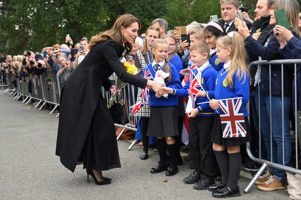Students from Howard Junior School in King's Lynn greet Britain's Catherine, Princess of Wales, as she meets people gathered outside Sandringham Estate, following the death of Britain's Queen Elizabeth, in eastern England, Britain, September 15, 2022. REUTERS