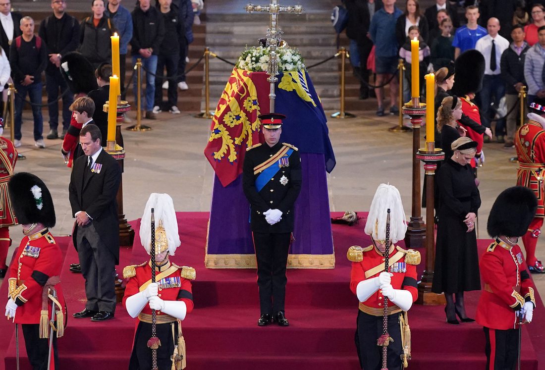 Queen Elizabeth II 's grandchildren (clockwise from front centre) the Prince of Wales, Peter Phillips, James, Viscount Severn, Princess Eugenie, the Duke of Sussex, Princess Beatrice, Lady Louise Windsor and Zara Tindall hold a vigil beside the coffin of their grandmother as it lies in state on the catafalque in Westminster Hall, at the Palace of Westminster, London. Picture date: Saturday September 17, 2022. Yui Mok/Pool via REUTERS