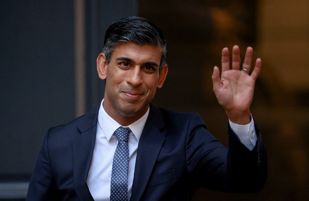 New leader of Britain's Conservative Party Rishi Sunak waves outside the party's headquarters in London, Britain, October 24, 2022. REUTERS/Henry Nicholls REFILE - QUALITY REPEAT