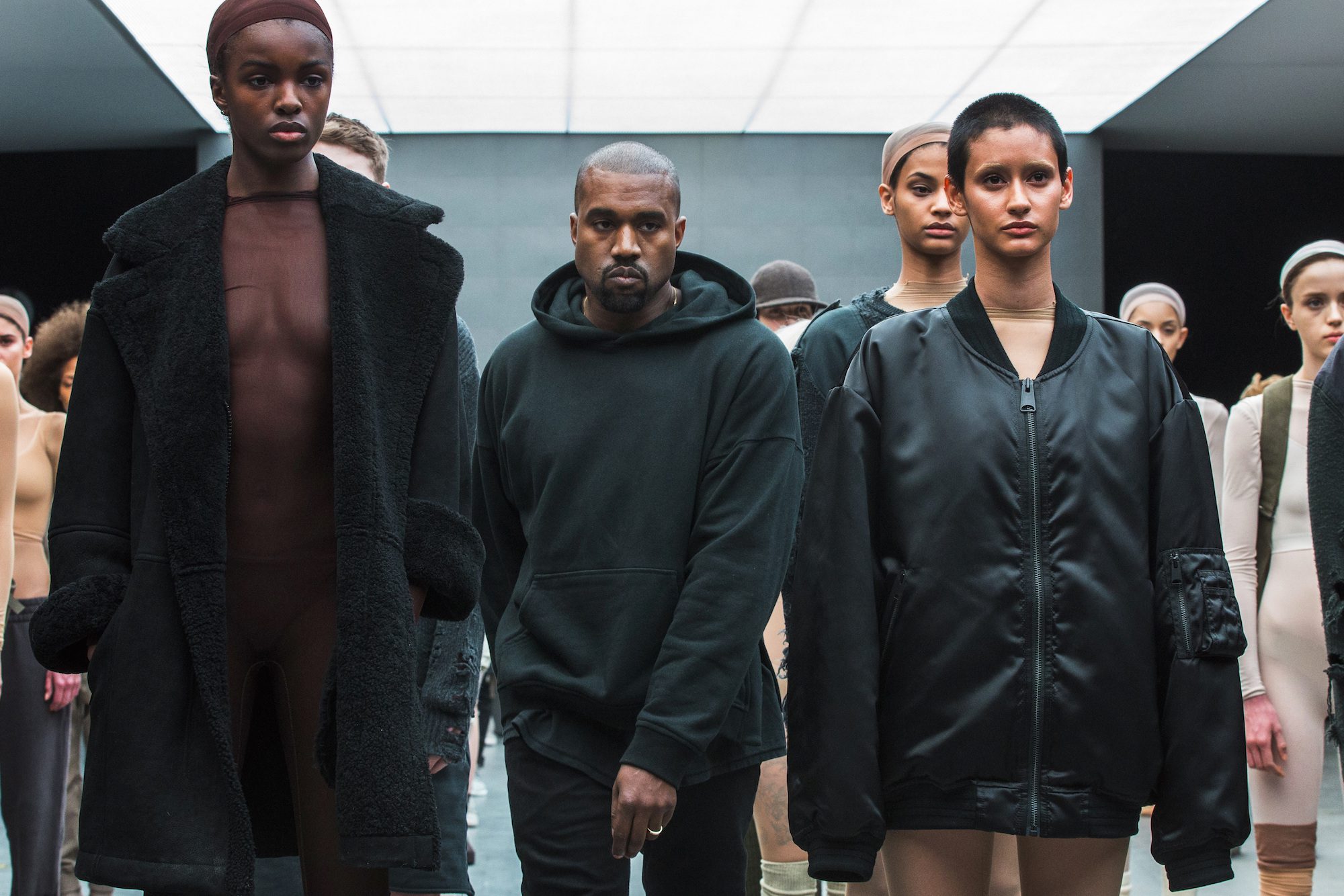 Singer Kanye West walks past models after presenting his Fall/Winter 2015 partnership line with Adidas at New York Fashion Week February 12, 2015. REUTERS/Lucas Jackson/File Photo