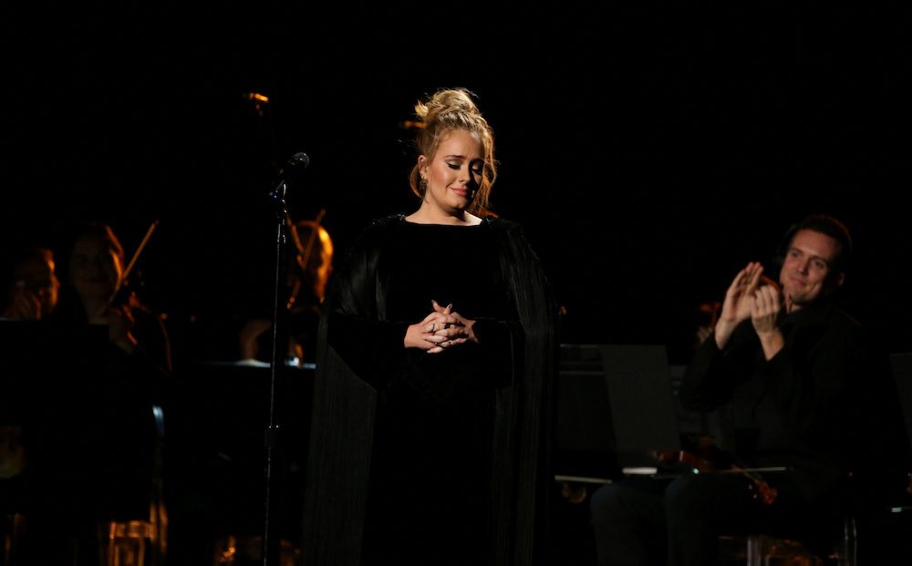 FILE PHOTO: Singer Adele is applauded as he finishes her tribute to the late George Michael at the 59th Annual Grammy Awards in Los Angeles, California, U.S. , February 12, 2017. REUTERS/Lucy Nicholson/File Photo