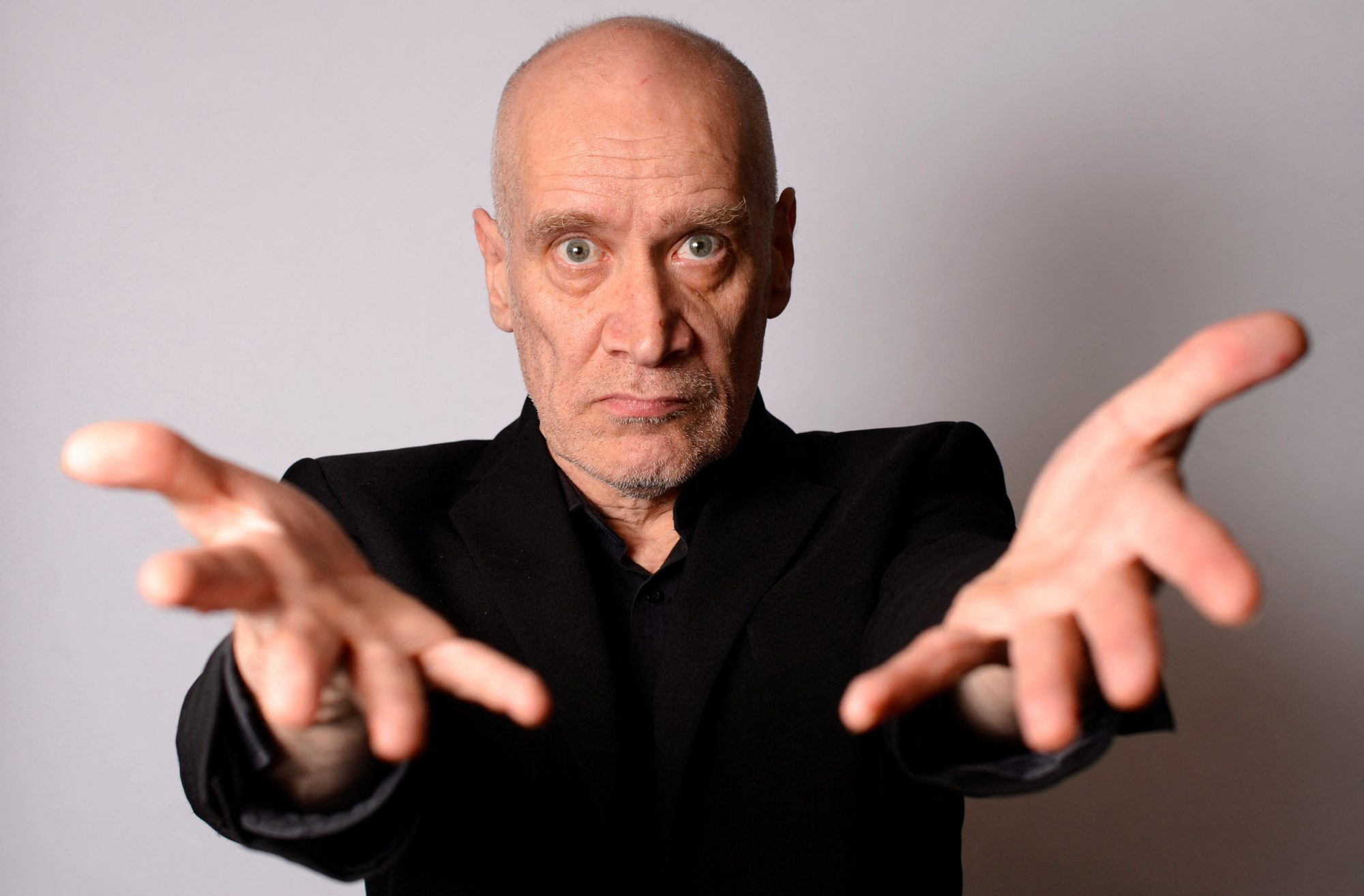 FILE PHOTO: Musician Wilko Johnson poses for a photograph at his home in Westcliff - on- sea, Essex, southern England in 2013.   REUTERS/Paul Hackett/File Photo