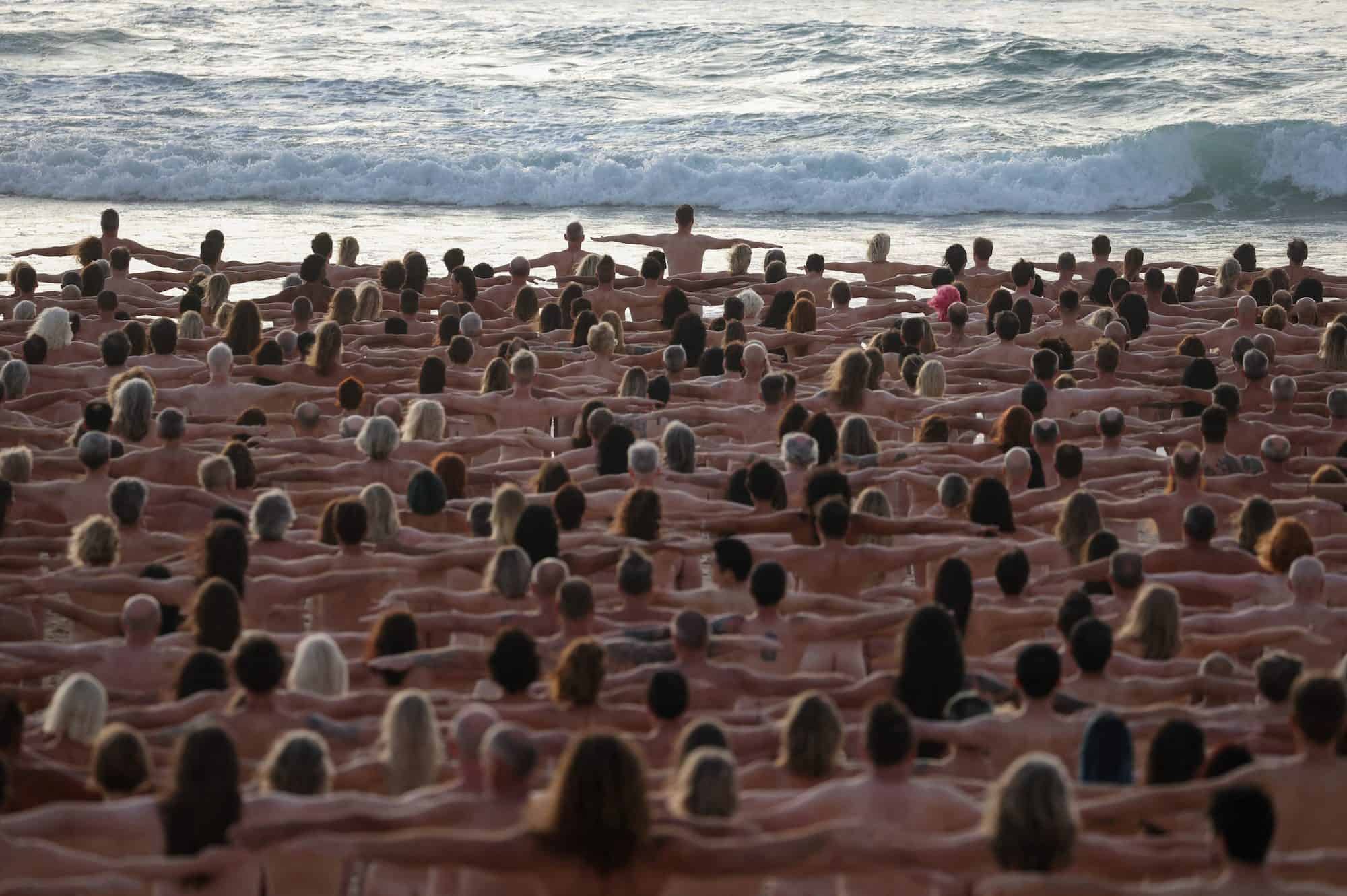 People stand naked as part of artist Spencer Tunick's art installation to raise awareness of skin cancer and encourage people to have their skin checked, at Bondi Beach in Sydney, Australia, November 26, 2022.  REUTERS/Loren Elliott  EDITORIAL USE ONLY.