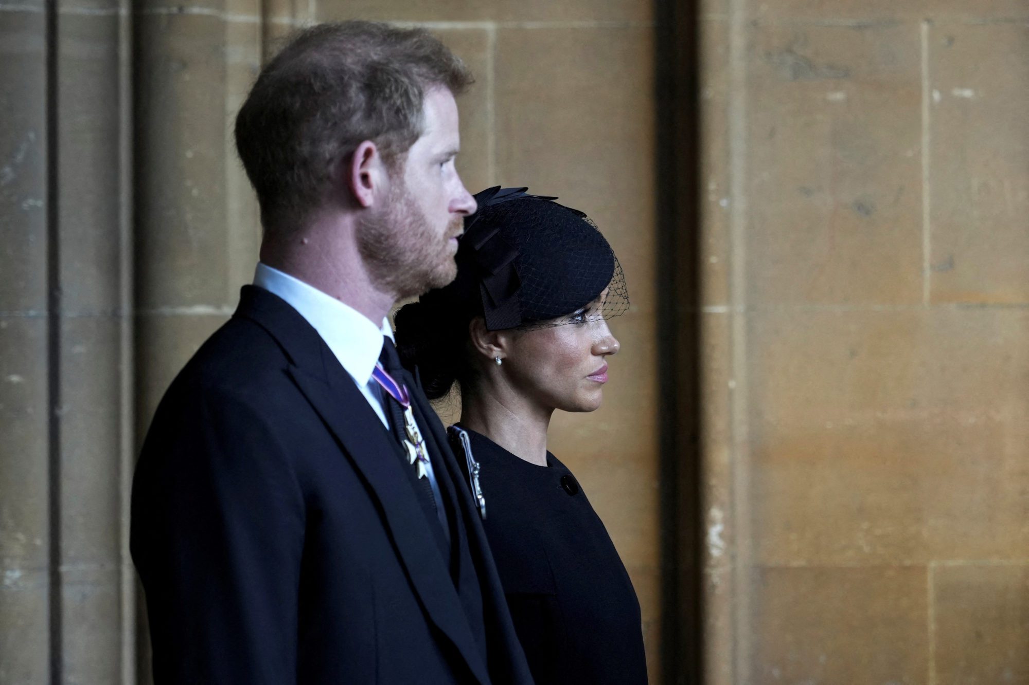 FILE PHOTO: Britain's Prince Harry, left, an Meghan, Duchess of Sussex, leave after they paid their respects to Queen Elizabeth II in Westminster Hall for the Lying-in State, in London, Wednesday, Sept. 14, 2022. Emilio Morenatti/Pool via REUTERS