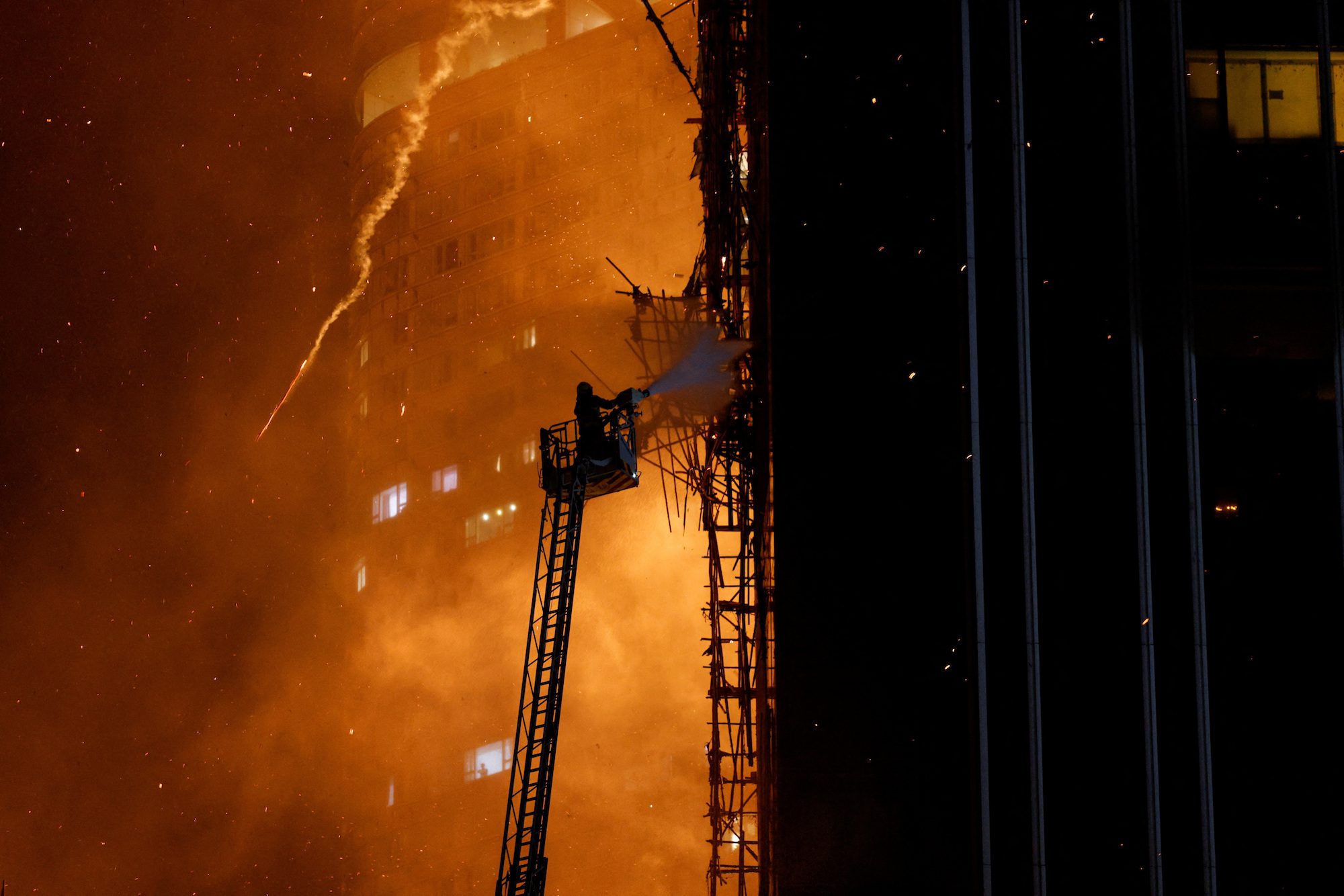 A building is seen on fire in Hong Kong, China March 3, 2023. REUTERS/Tyrone Siu