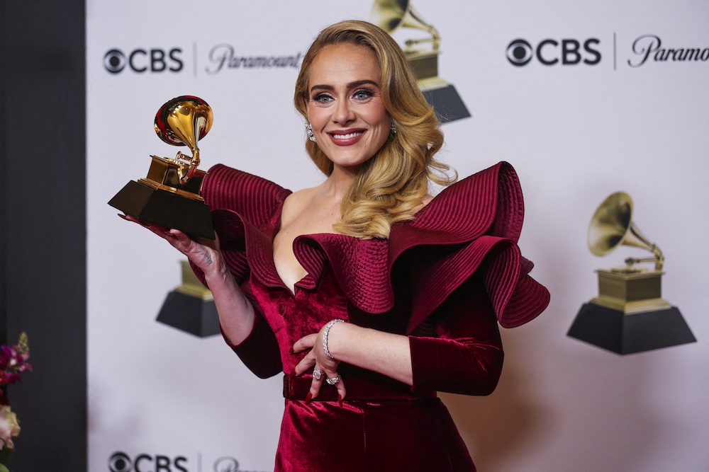 FILE PHOTO: Adele poses with her Grammy for Best Pop Solo Performance for "Easy On Me" during the 65th Annual Grammy Awards in Los Angeles, California, U.S., February 5, 2023. REUTERS/Mike Blake/