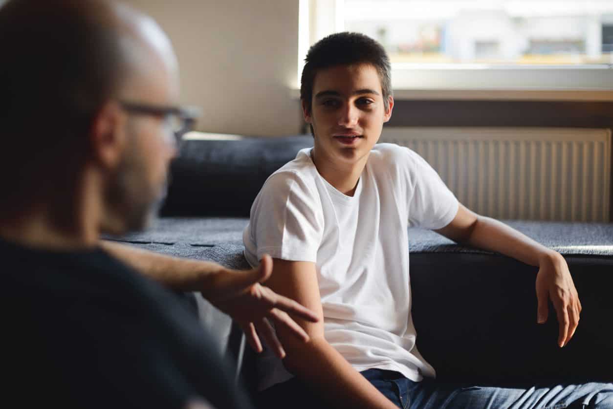 boy talking to father