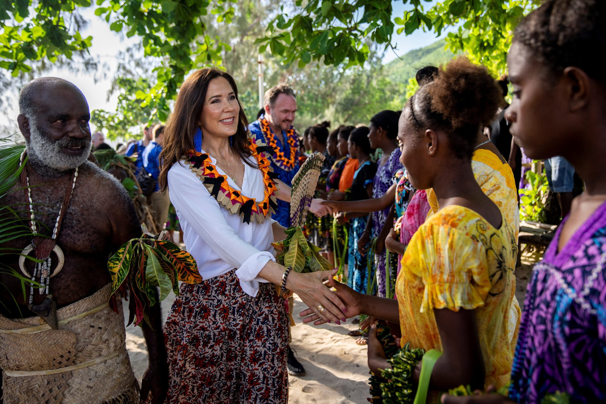 Island's inhabitants welcome Danish Crown Princess Mary and Dan Jorgensen, Minister for Development Cooperation and Global Climate Policy during their visit to Pele Island, to highlight the challenges that the local communities of the Pacific islands face in connection with climate change, in Vanuatu, April 23, 2023.  Ritzau Scanpix via REUTERS   
