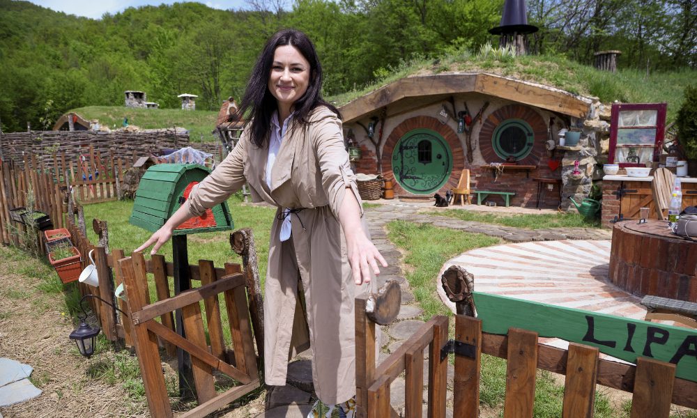Milijana Milicevic stands in front of the hobbit house named "Lipa", in the Bosnian Hobbiton village, Rakova Noga, Bosnia and Herzegovina, May 9, 2023. REUTERS/Amel Emric