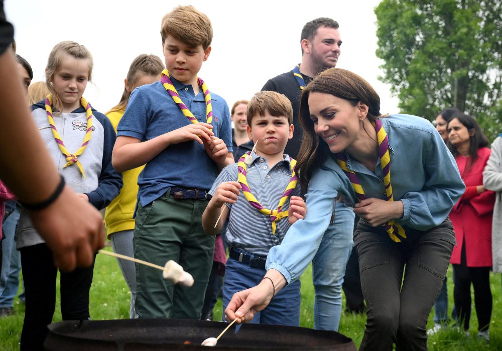 Prince George of Wales, Britain's Prince Louis of Wales and Britain's Catherine, Princess of Wales, toast marshmallows as they take part in the Big Help Out, during a visit to the 3rd Upton Scouts Hut in Slough, west of London, Britain, May 8, 2023. Daniel Leal/Pool via REUTERS TPX IMAGES OF THE DAY