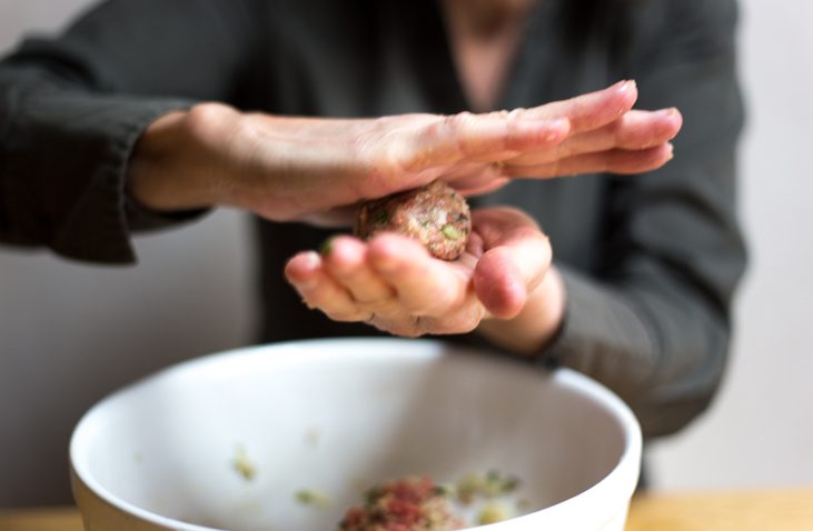 Woman Rolling Meatballs Close-Up