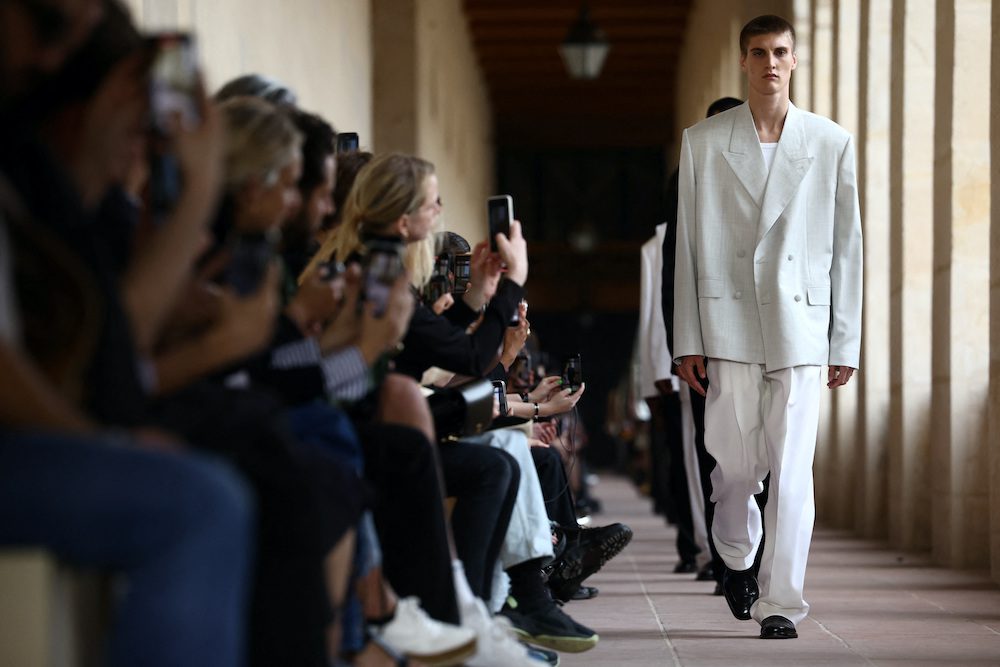 Models present creations by designer Matthew M. Williams as part of his Menswear ready-to-wear Spring/Summer 2024 collection show for fashion house Givenchy during Men's Fashion Week in Paris, France, June 22, 2023.  REUTERS/Stephanie Lecocq