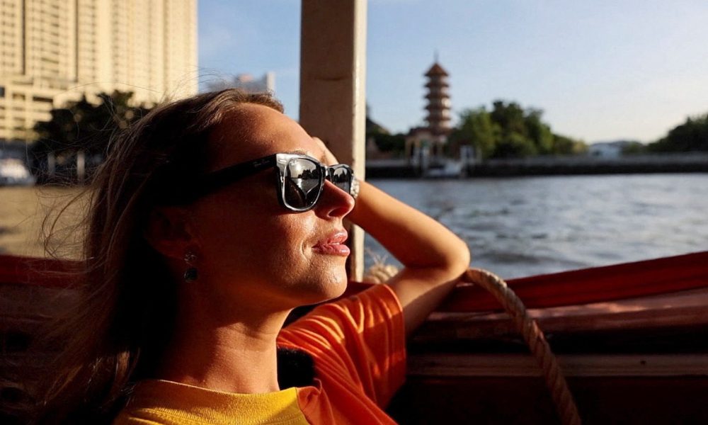Lillian Smith, 30, from Mississippi, U.S., during a city tour at Wat Arun temple in Bangkok, Thailand May 13, 2023. REUTERS/Jorge Silva