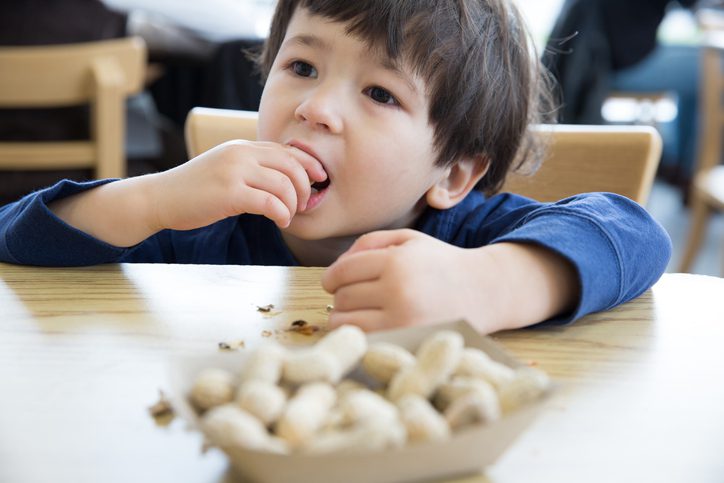 Child eating peanuts