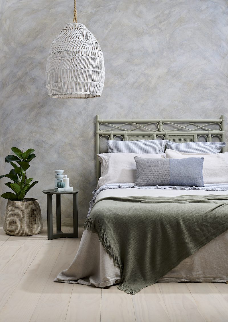 The bedroom is often the ultimate sanctuary. Restful Resene greens, cloudy greys and light timber washes can help set the tone for soothing slumber and ensure your body gets the sleep it needs to recover after a stressful day. Walls painted in Resene Creme De La Creme with Resene FX Paint Effects Medium mixed with Resene Parchment, Resene Rocky Point and Resene Rice Cake, floor in Resene Colorwood Breathe Easy, headboard in Resene Hindsight, bedside table in Resene Rocky Point, pendant lamp in Resene Rice Cake and décor accessories in Resene Morning Haze and Resene Timeless. Bedlinen from Container Door, throw from Freedom, cushion and euro pillowcases from Society of Wanderers.
