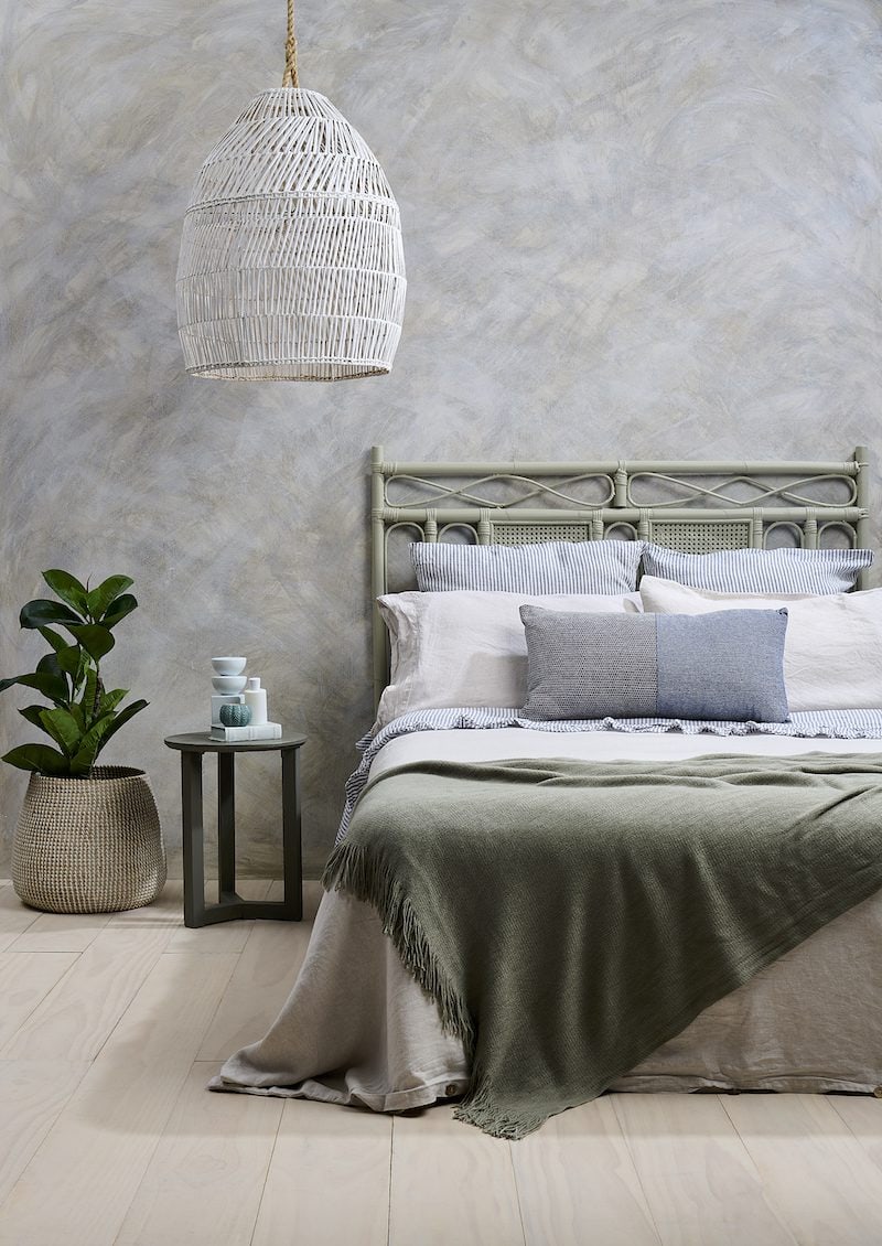 The bedroom is often the ultimate sanctuary. Restful Resene greens, cloudy greys and light timber washes can help set the tone for soothing slumber and ensure your body gets the sleep it needs to recover after a stressful day. Walls painted in Resene Creme De La Creme with Resene FX Paint Effects Medium mixed with Resene Parchment, Resene Rocky Point and Resene Rice Cake, floor in Resene Colorwood Breathe Easy, headboard in Resene Hindsight, bedside table in Resene Rocky Point, pendant lamp in Resene Rice Cake and décor accessories in Resene Morning Haze and Resene Timeless. Bedlinen from Container Door, throw from Freedom, cushion and euro pillowcases from Society of Wanderers.