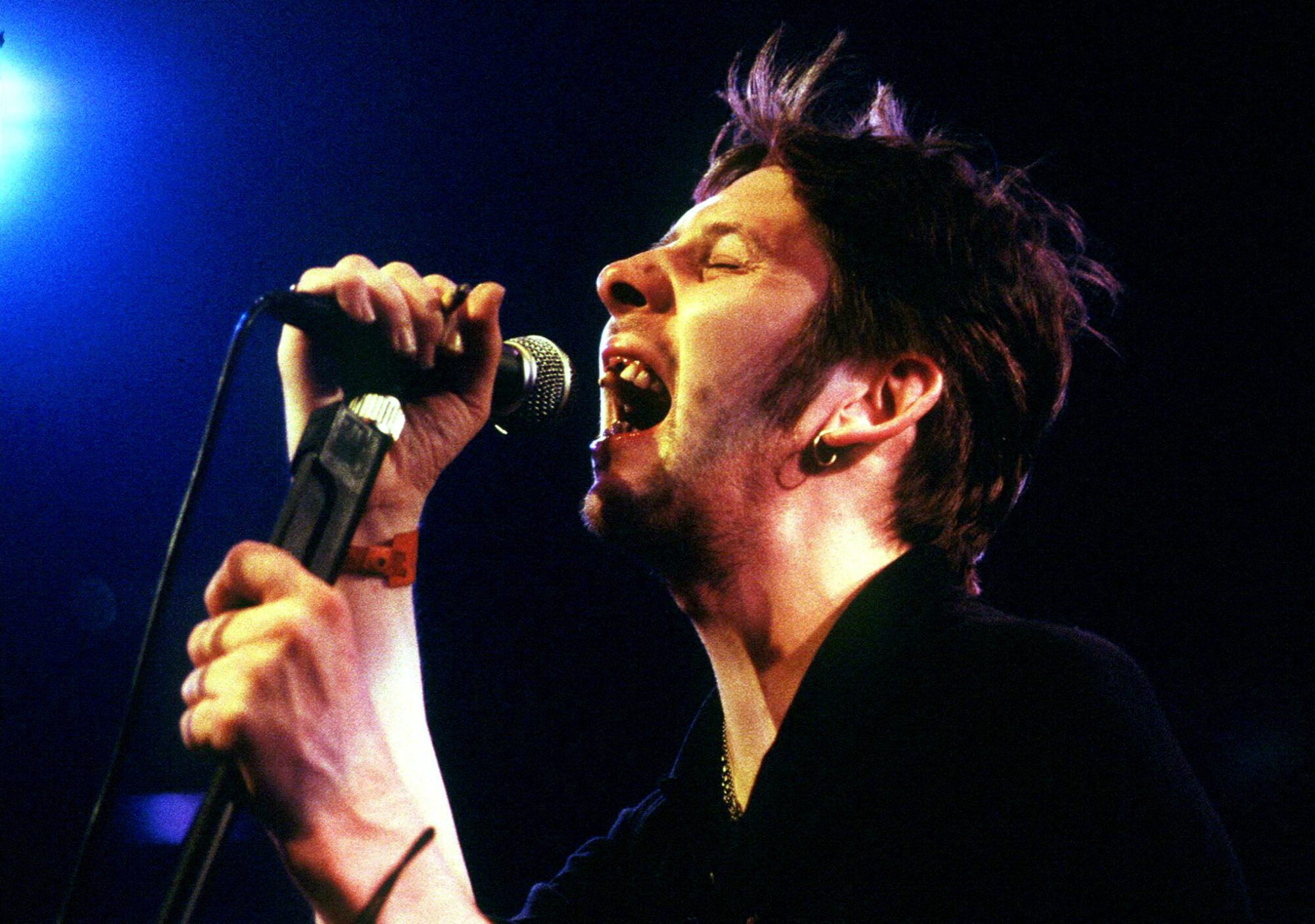 FILE PHOTO: Shane MacGowan, former lead singer of The Pogues, performs during the Montreux Jazz festival in the [Miles Davis] Hall late July 15, 1995. MacGowan and his band The Popes were part of the 'Irish Night' during the festival. REUTERS/Stringer/File Photo