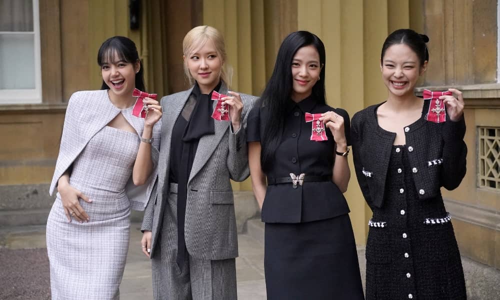 Lisa (Lalisa Manoban), Rose (Roseanne Park), Jisoo Kim and Jennie Kim, from the K-Pop band Blackpink pose with their Honorary MBEs. Image / Reuters