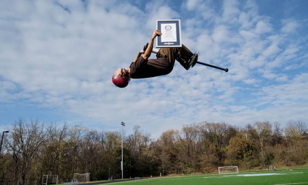 Henry Cabelus, from U.S., who achieves the highest backflip pogo stick jump is 3.07 m (10 ft 1 in), performs in Pittsburgh, Pennsylvania, U.S. November 4, 2023 in celebration of Guinness World Records Day 2023.