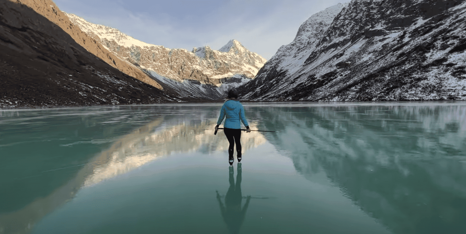 Surreal Moment Alaskan Outdoor Instructor Skates on Rare Ice Window