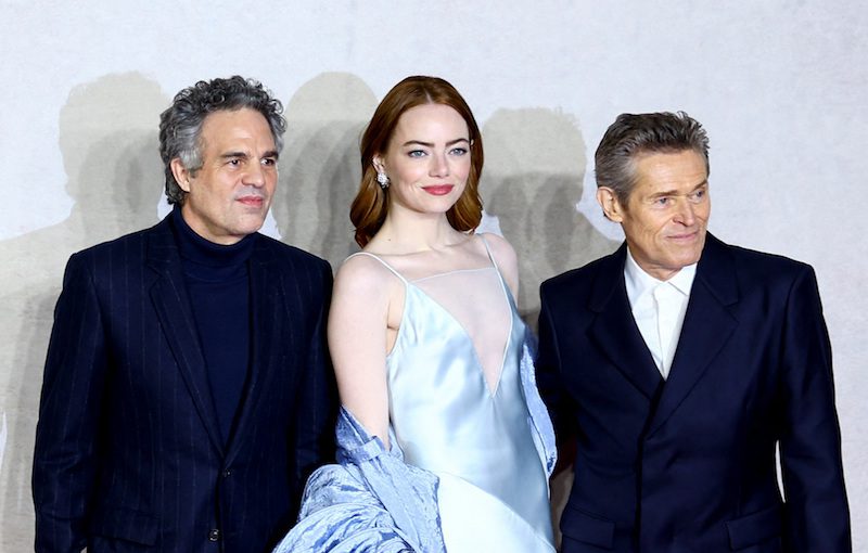 Cast members Emma Stone, Mark Ruffalo and Willem Dafoe attend the red carpet for the premiere of the Venice Golden Lion-winning movie "Poor Things" at Barbican Centre in London, Britain, December 14, 2023. REUTERS/Hannah McKay
