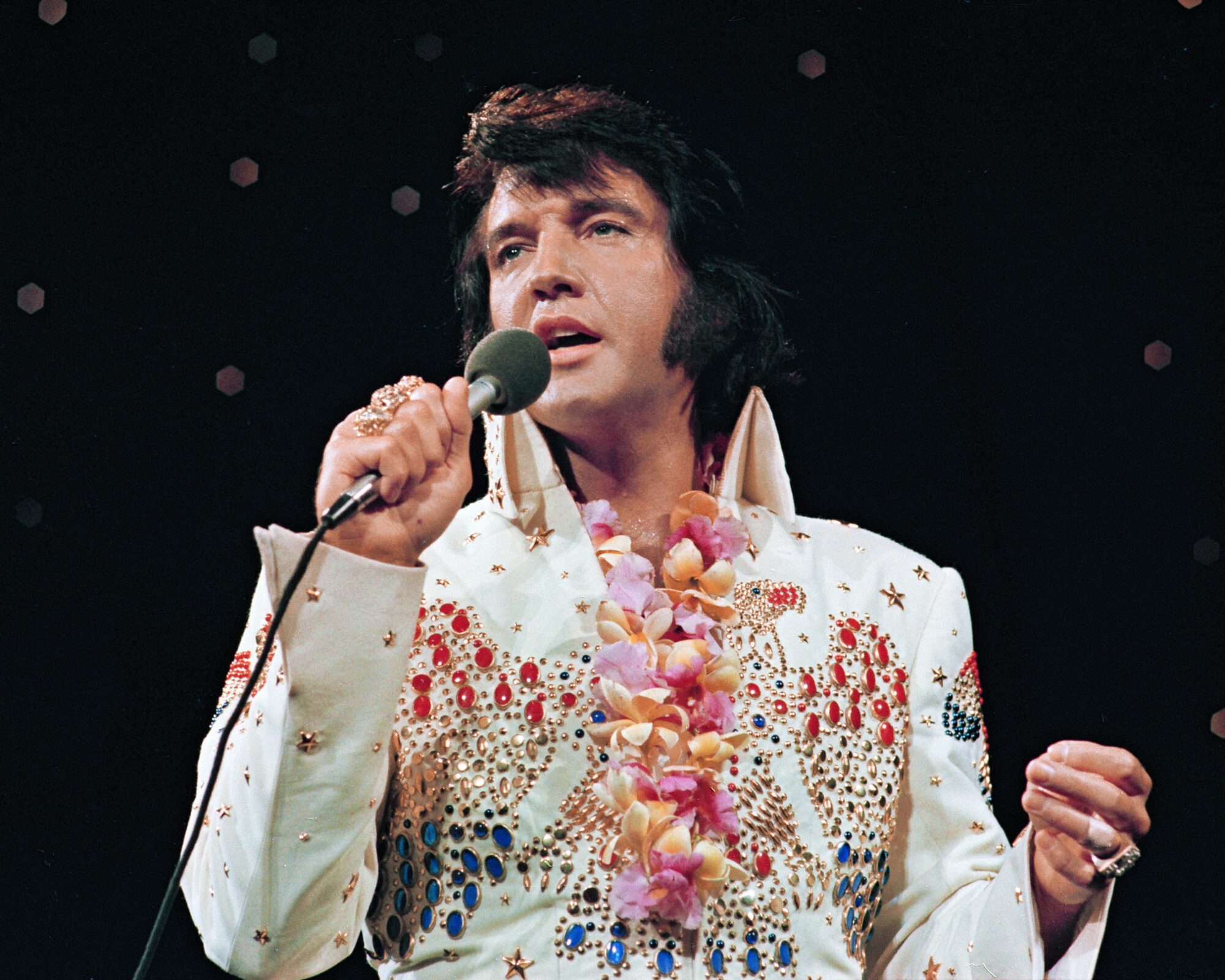 FILE PHOTO: Elvis Presley performs at the "Aloha from Hawaii' concert special in January 1973, in Honolulu, Hawaii, U.S., in this handout image. Elvis Presley Enterprises LLC/Handout via REUTERS/File Photo