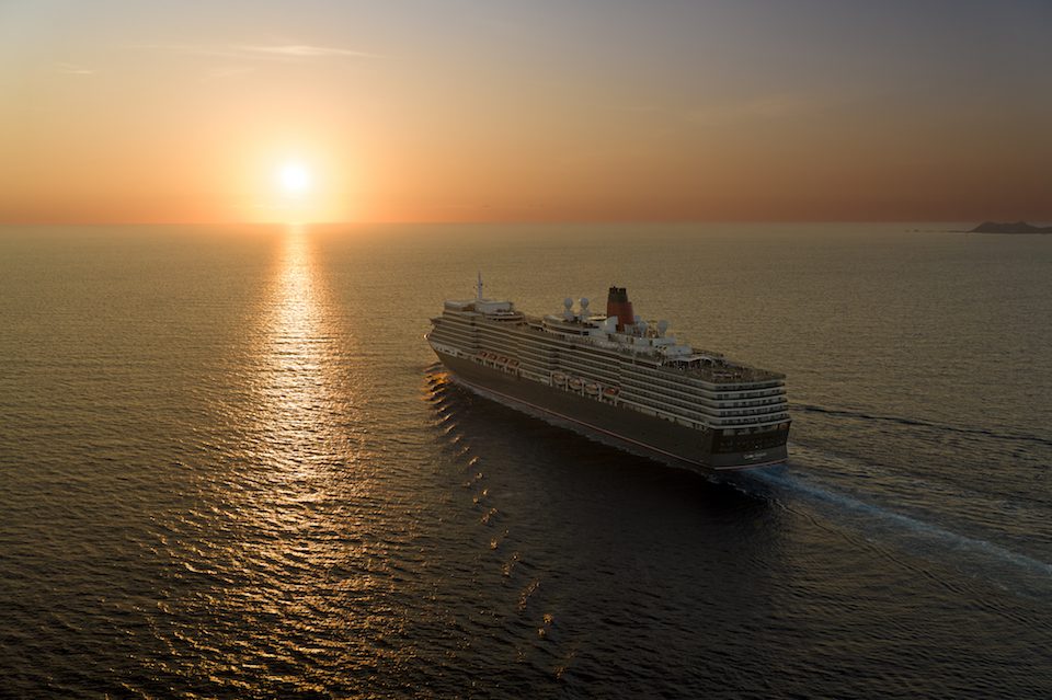 Queen Elizabeth sailing into the sunset 