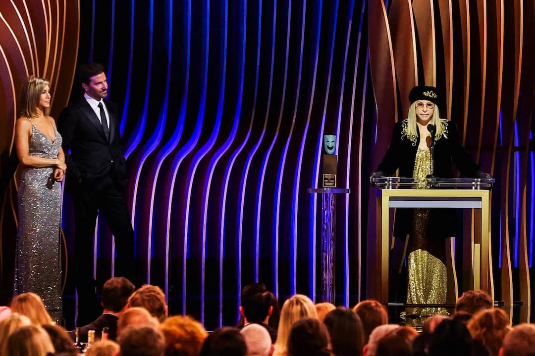 Barbra Streisand receives the SAG Life Achievement Award as Jennifer Aniston and Bradley Cooper look on