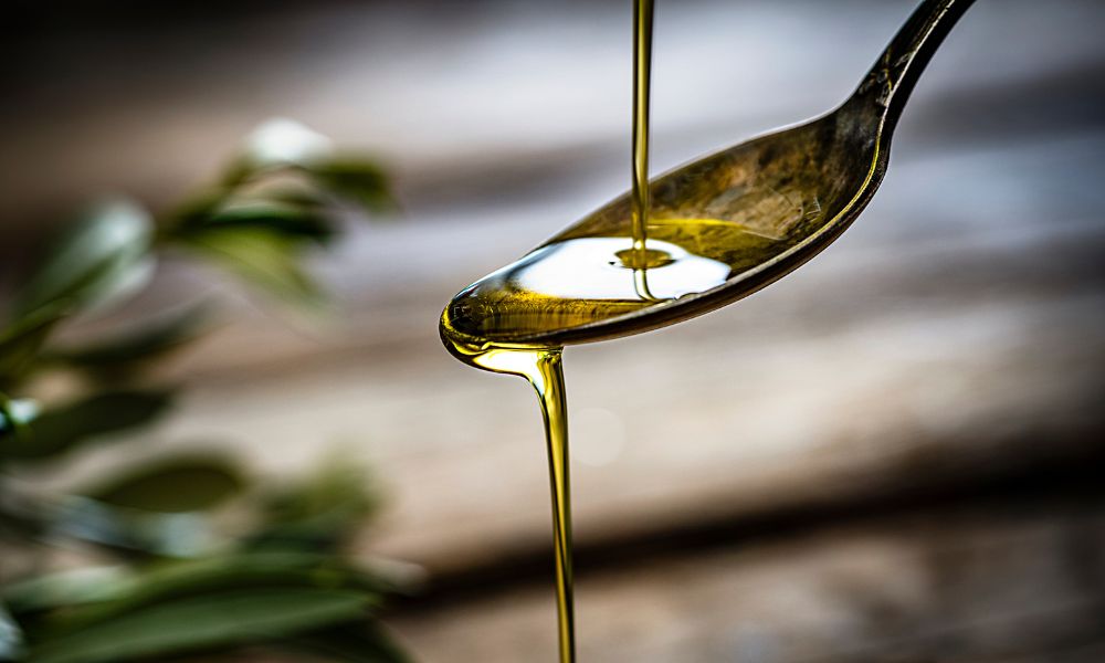 Olive oil on a spoon.