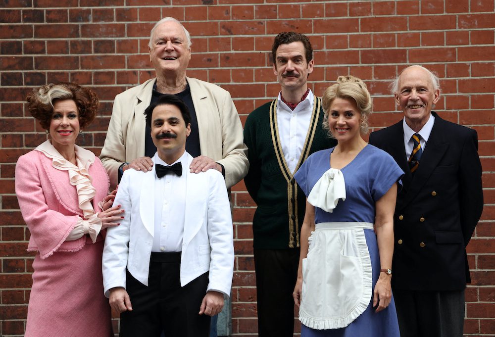 British actor John Cleese poses with cast members from the play Fawlty Towers at the Apollo Theatre in London, Britain, May 2, 2024. From left are: Anna-Jane Casey (Sybil), Hemi Yeroham (Manuel), Adam Jackson-Smith (Basil), Victoria Fox (Polly) and Paul Nicholas (The Major). REUTERS/Suzanne Plunkett