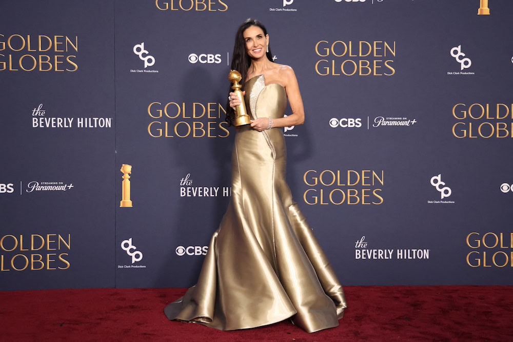 FILE PHOTO: Demi Moore poses with the award for Best Performance by an Actress in a Motion Picture - Musical or Comedy, for The Substance, at the 82nd Golden Globe Awards in Beverly Hills, California, U.S., January 5, 2025. REUTERS/Mario Anzuoni/File Photo