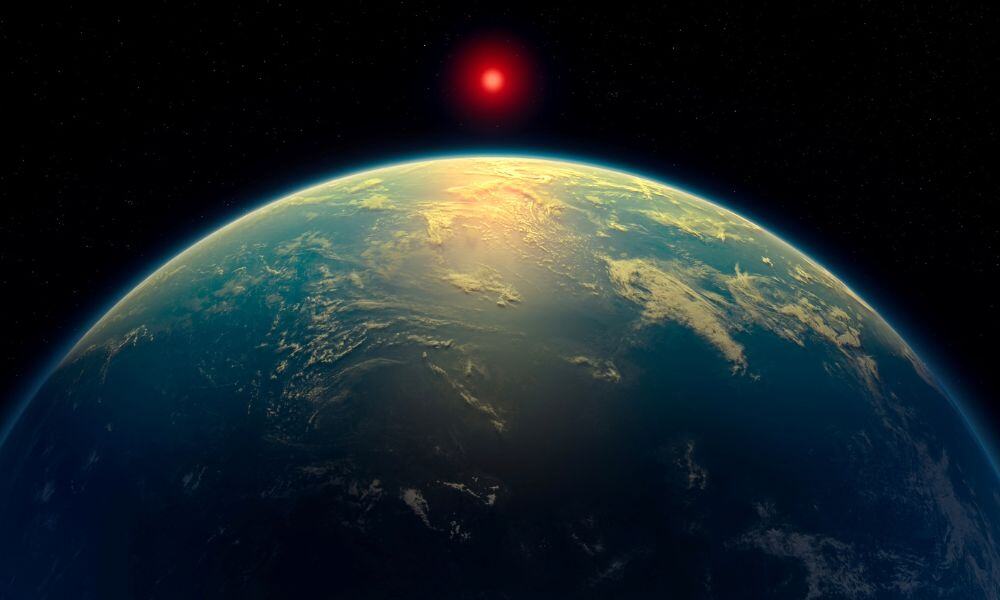 An illustration shows a hycean world – an exoplanet with a liquid water ocean beneath a hydrogen-rich atmosphere - orbiting a red dwarf star. Based on observations by the James Webb Space Telescope, the exoplanet K2-18 b might fit in this category. This illustration was obtained by Reuters on April 16, 2025. A. Smith, N. Madhusudhan/University of Cambridge/Handout via REUTERS