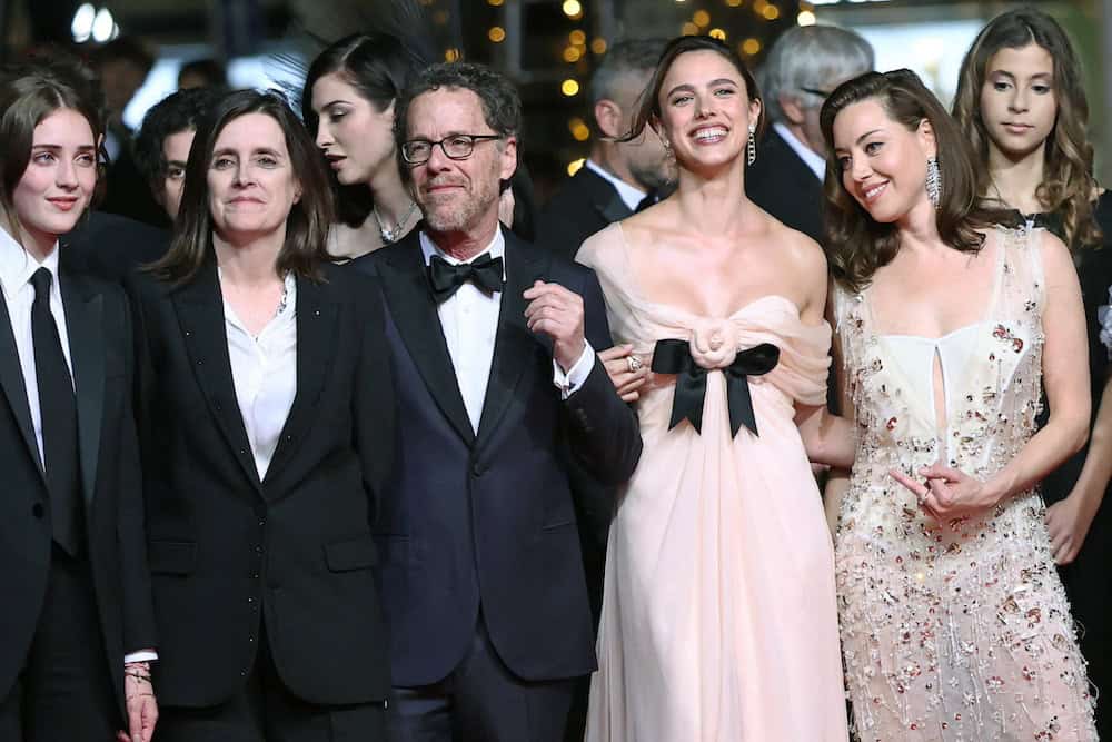 Director Ethan Coen, screenwriter Tricia Cooke, and cast members Margaret Qualley, Aubrey Plaza, and Talia Ryder pose on the red carpet during arrivals for the screening of the film "Honey Don't!" presented as part of midnight screenings at the 78th Cannes Film Festival in Cannes, France, May 24, 2025. REUTERS/Stephane Mahe