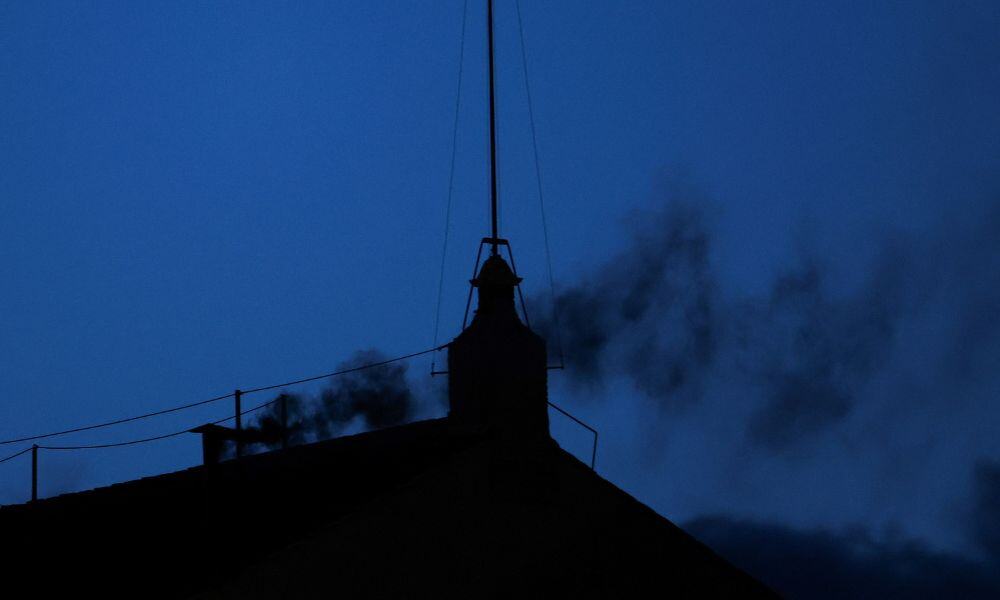 Black smoke rises from the chimney on the Sistine Chapel, indicating no decision has been made to elect a new pope, at the Vatican, May 7, 2025. REUTERS/Murad Sezer