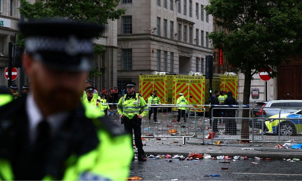 Emergency services at an incident involving a car and supporters during the Victory parade. Photo / Reuters
