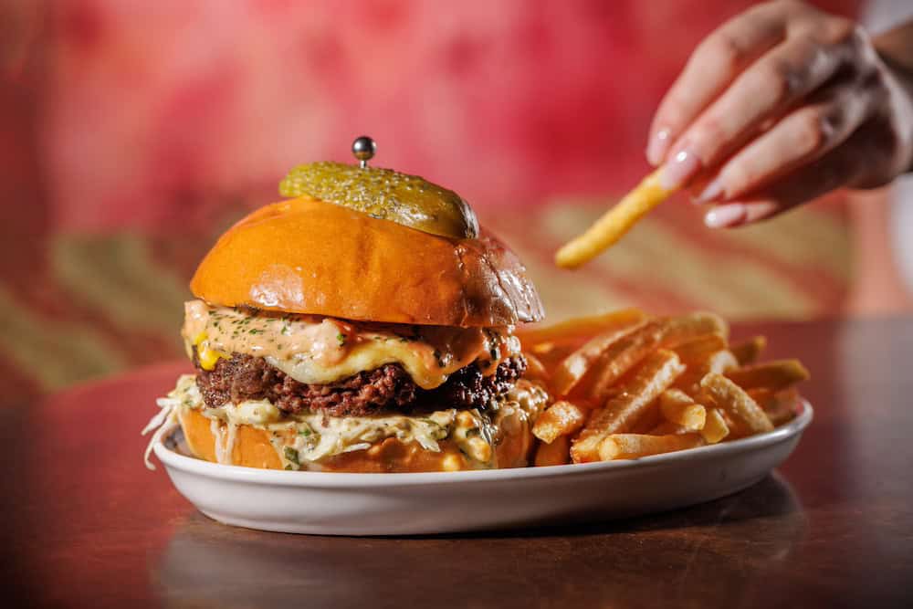 Jacuzzi, Wagyu Surf N' Turf Burger with French Fries. Photo Credit: Babiche Martens