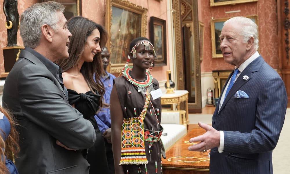 King Charles speaks with George and Amal Clooney and Alice, during a reception at Buckingham Palace. Photo / Getty Images