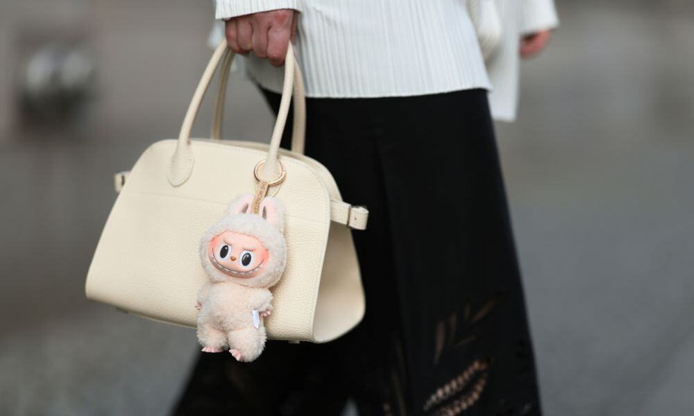 The Labubu toy trend has extended the favour for clipping charms to the handle of a handbag. Photo / Getty Images