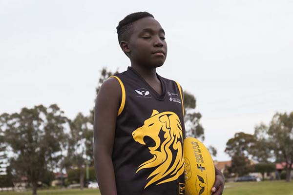 Bohneur Cubahiro and his family moved to Australia from Burundi, Africa as refugees when he was two years old. At the age of eight, he joined the Edmund Rice Centre Lions – a not-for-profit AFL program with a focus on multiculturalism and quickly fell in love with the sport. Now, at 11, he is both the coach of his team and the captain of his district squad.