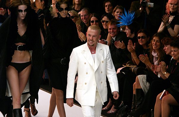 British designer Alexander McQueen receives applause at the end of his
ready-to-wear 2003 spring-summer collection in Paris October 5, 2002.
REUTERS/Philippe Wojazer
