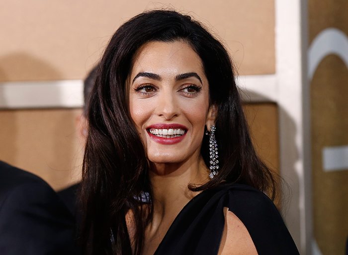 Amal Clooney partners with nonprofit to provide scholarships to young women.