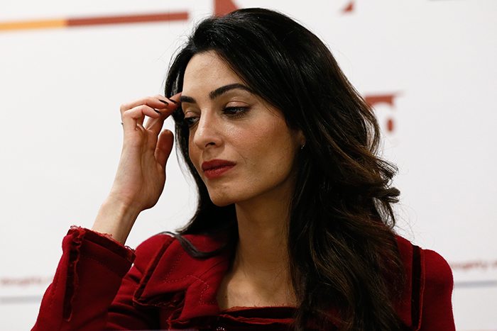 Lawyer Amal Clooney reacts during a news conference for Mohamed Nasheed, in central London, Britain January 25, 2016. Former president of the Maldives, Nasheed, freed from jail last week to seek medical care in Britain, called on Monday for sanctions against Maldivian government figures as his lawyer warned a militant attack on tourists was highly likely. REUTERS/Stefan Wermuth
