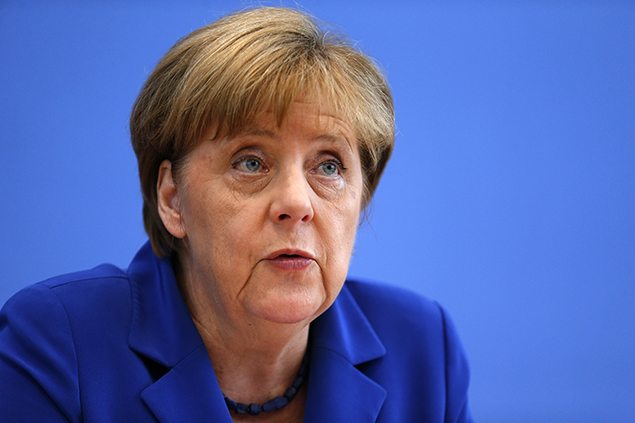 German Chancellor Angela Merkel addresses a news conference in Berlin.    REUTERS/Hannibal Hanschke. 