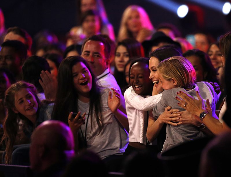 Angelina Jolie celebrates her win with her two daughters, Zahara and Shiloh. 