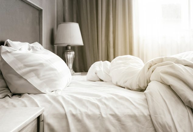 Bed sheet mattress Duvet and pillows unmade