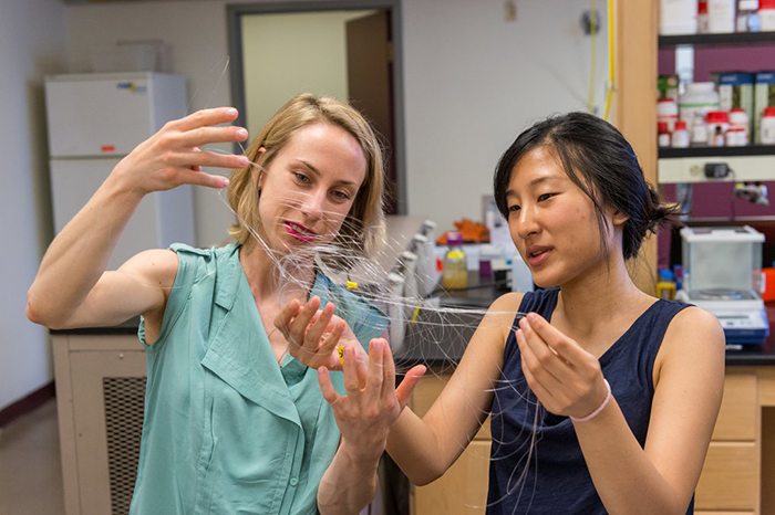 CSNE researchers examine flexible neural recording fibers that can be used in implantable devices for restoring motor function in stroke and spinal cord injury patients. (Justin Knight Photography/MIT/Center for Sensorimotor Neural Engineering)